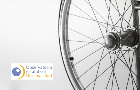 Imagen detalle de una silla de ruedas y logotipo del OED